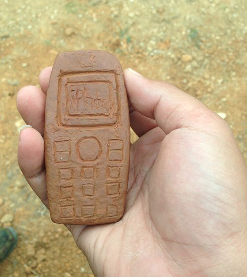 正版的山寨手机~器物gif搞笑图片